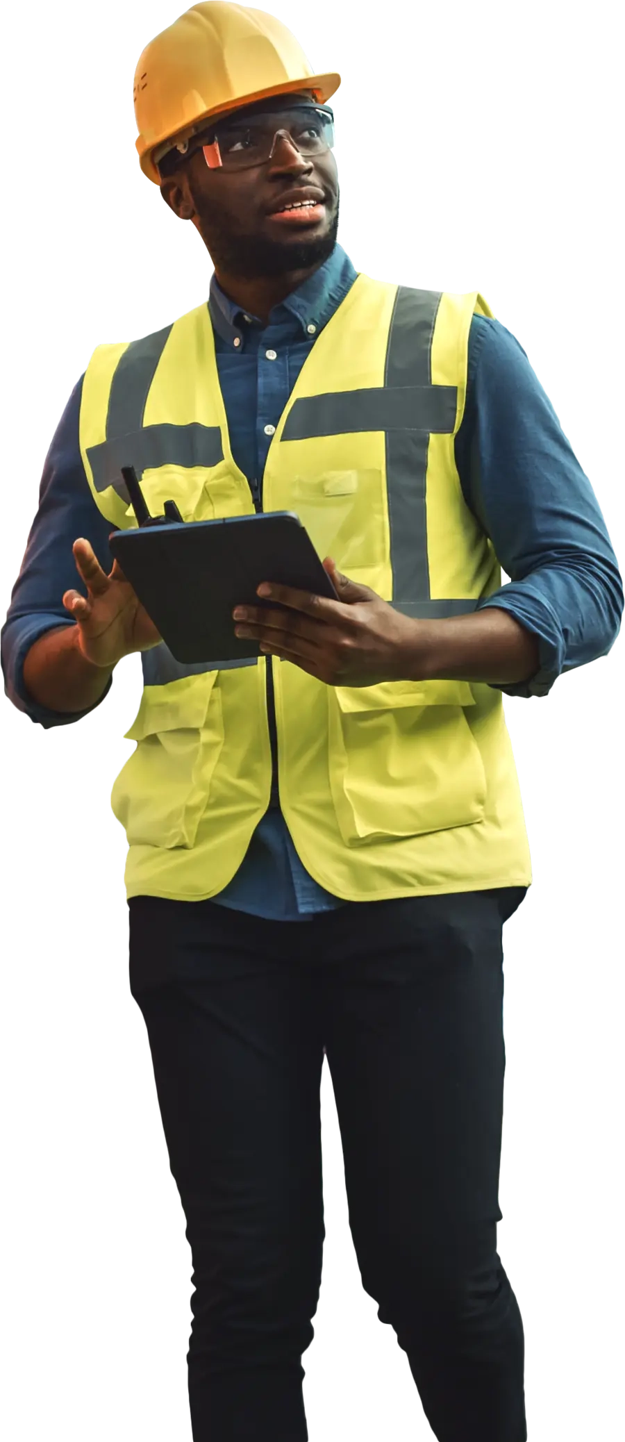 Safety manager in a hard hat and hi-vis vest checking a tablet